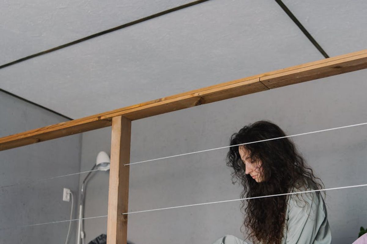 Person stretching in a minimalistic loft apartment